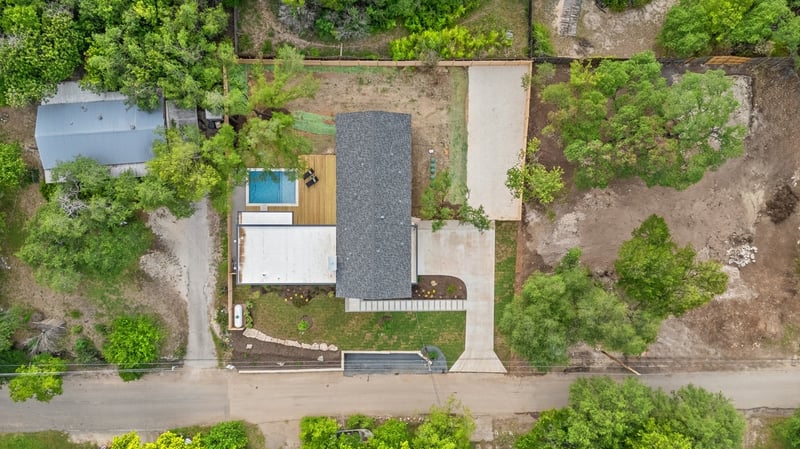 Aerial top-down view of lot with pool and home layout in a custom home in Austin, TX by J. Angelo Design Build