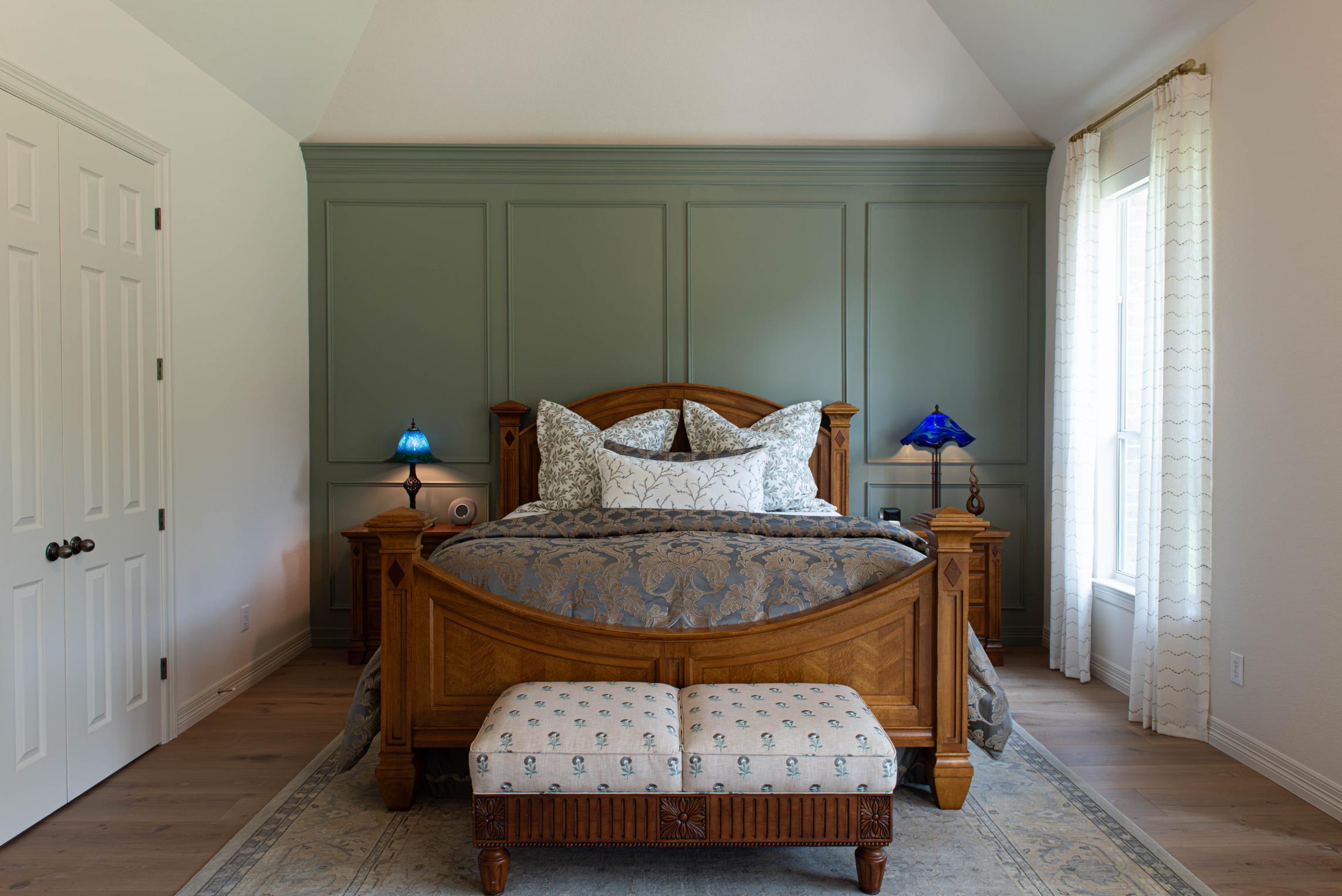 Master Bedroom, green wall w panels in Buda Whole Home Remodel