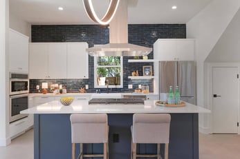 Remodeled kitchen with statement lighting by J. Angelo Design Build