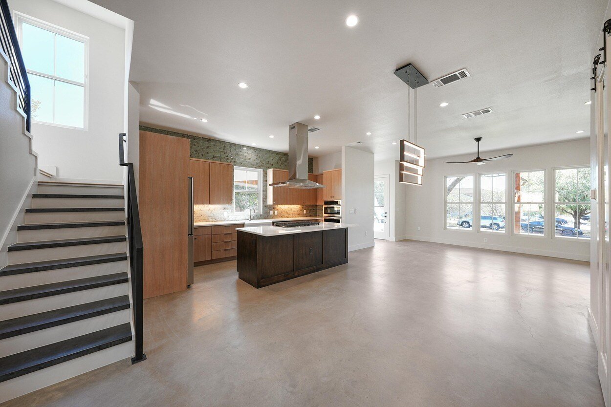 Recently finished kitchen featuring large windows in a custom home built by J. Angelo Design Build