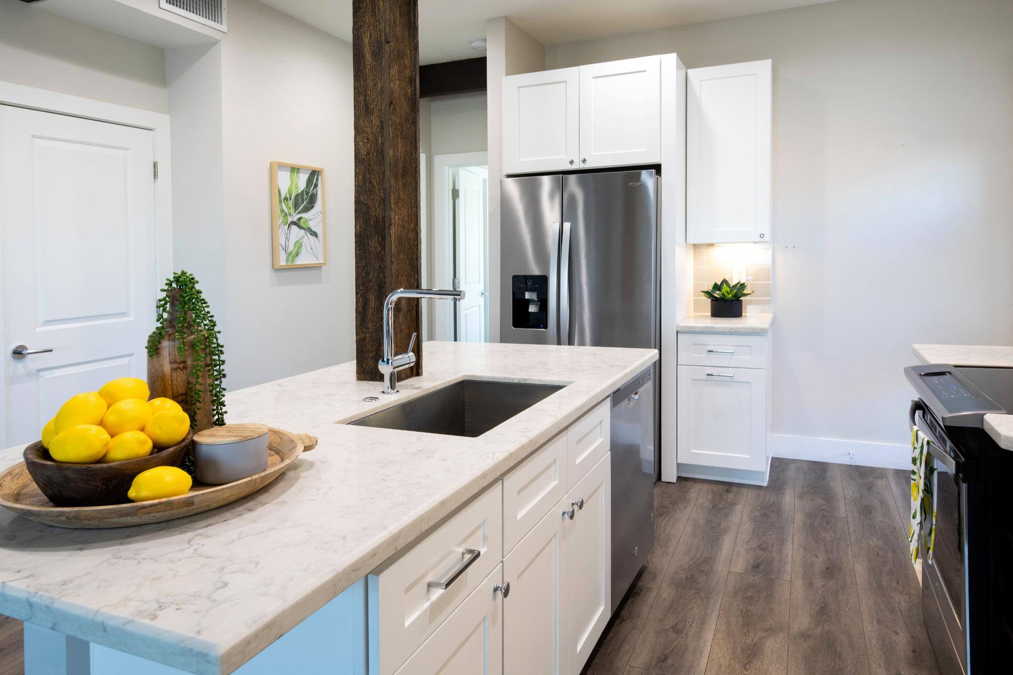 Remodeled kitchen with stainless steel appliances by J. Angelo Design Build