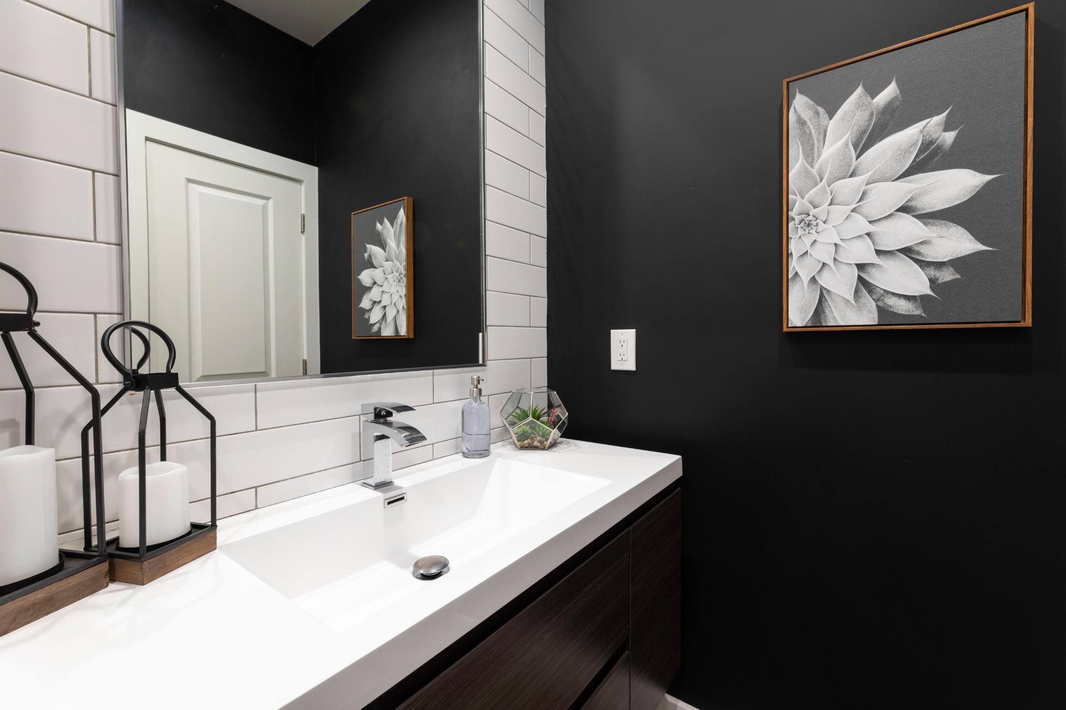 Remodeled moody bathroom by J. Angelo Design + Build