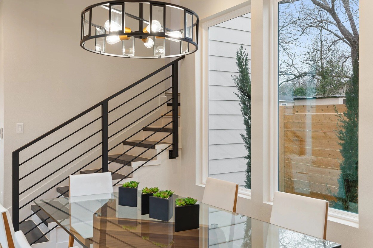 Custom dining area with a view of the staircase in a custom home in Austin, TX by J. Angelo Design Build