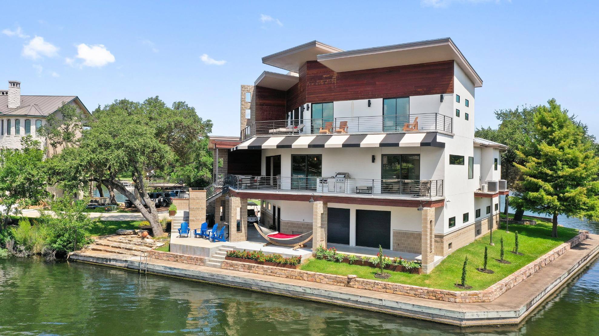 Side exterior of custom home on Lake LBJ in Austin, TX by J. Angelo