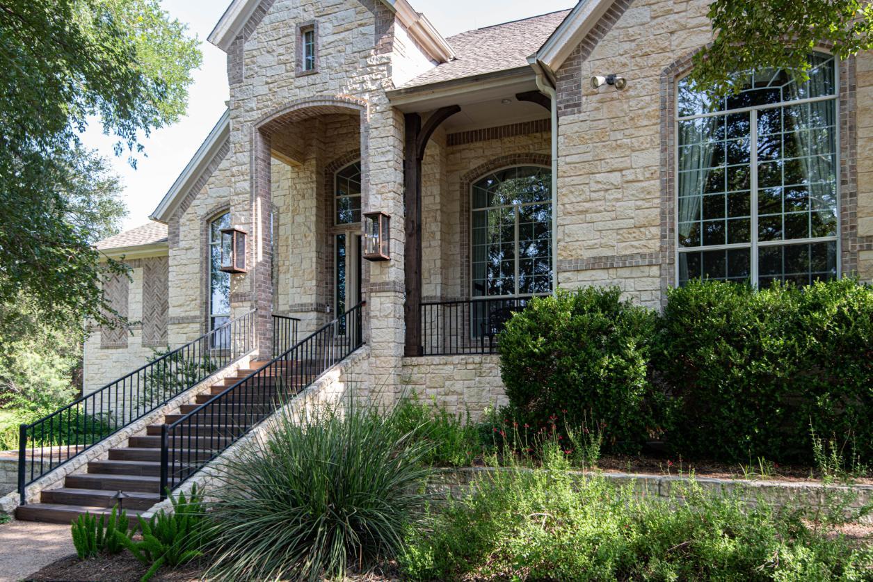 Exterior angled to front steps and door in Buda whole home remodel by J. Angelo Design Build Exterior angled to front steps and door in Buda whole home remodel by J. Angelo Design Build