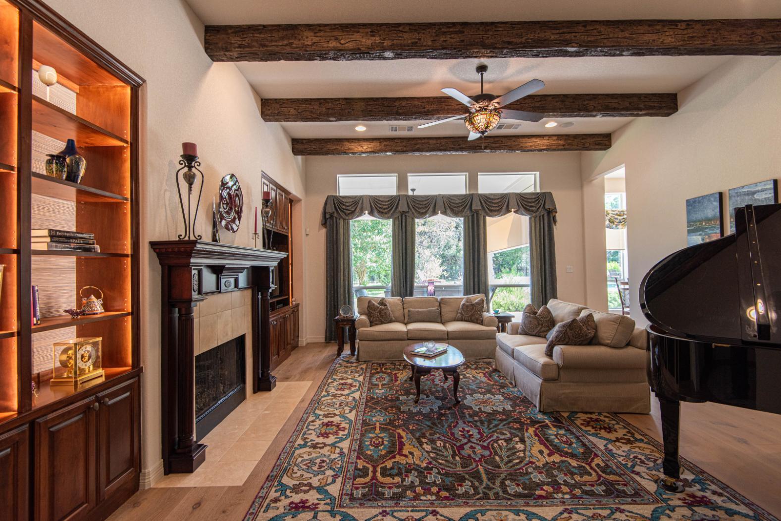 Family Room, gallery to back yard with lit built ins and exposed beams in Buda remodel by J. Angelo Design Build Family Room, gallery to back yard with lit built ins and exposed beams in Buda remodel by J. Angelo Design Build