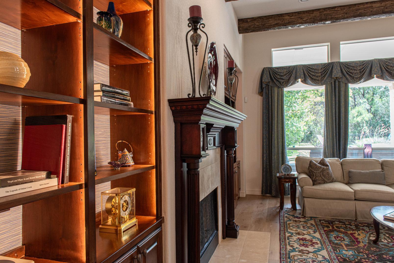 Family room, fireplace wall to backyard in Buda Whole Home Remodel by J. Angelo Design Build Family room, fireplace wall to backyard in Buda Whole Home Remodel by J. Angelo Design Build