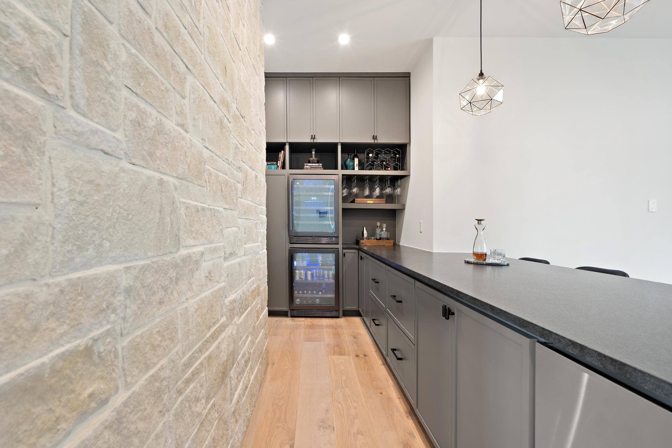 Bar area view behind the bar storage, cabinetry, and wine fridge in custom home built in Austin, TX by J. Angelo Design Build