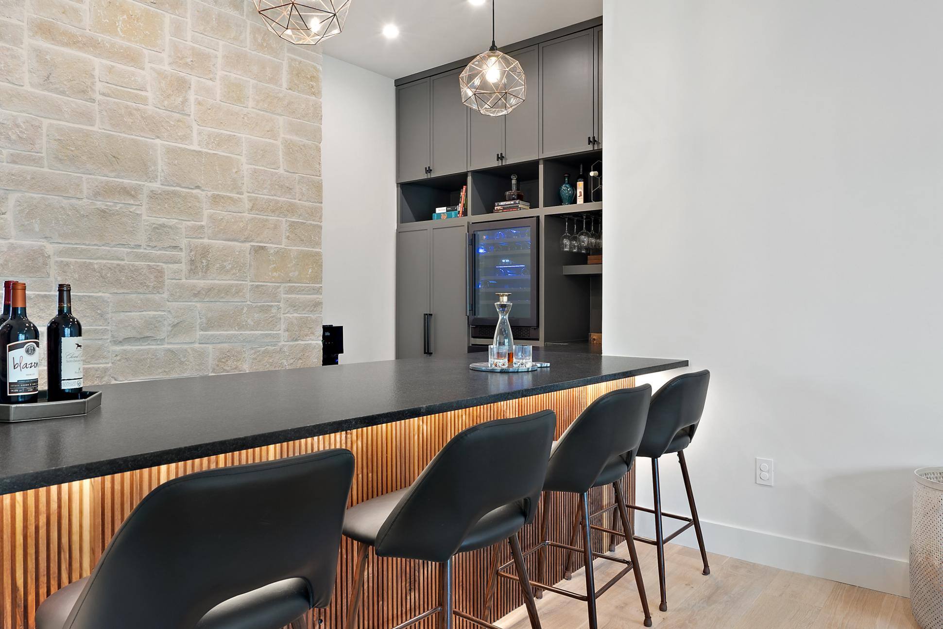 Bar area view of wine fridge and storage in custom home built in Austin, TX by J. Angelo Design Build