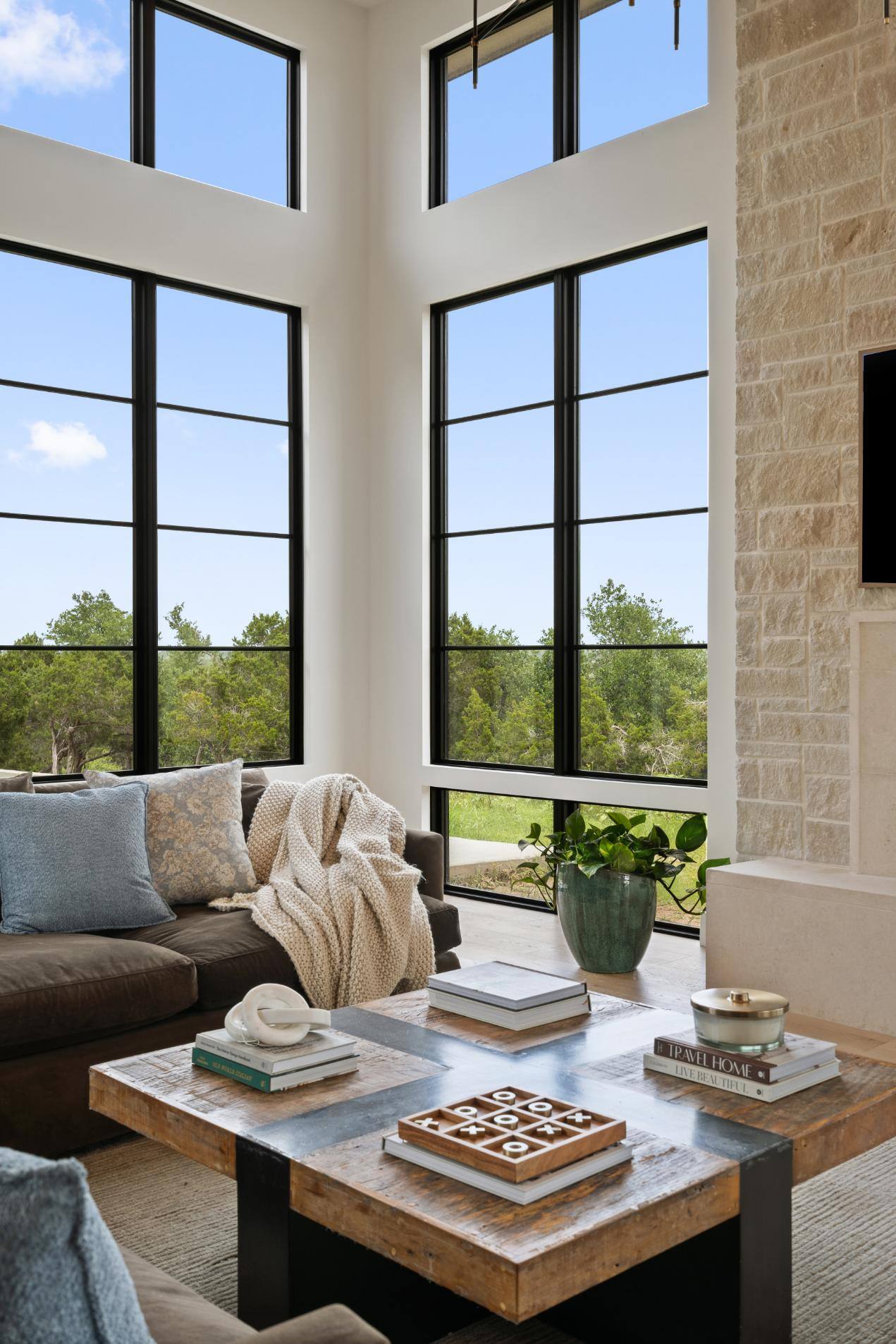 Corner of living room tall windows custom home by J. Angelo Design Build in Southwest Austin, TX