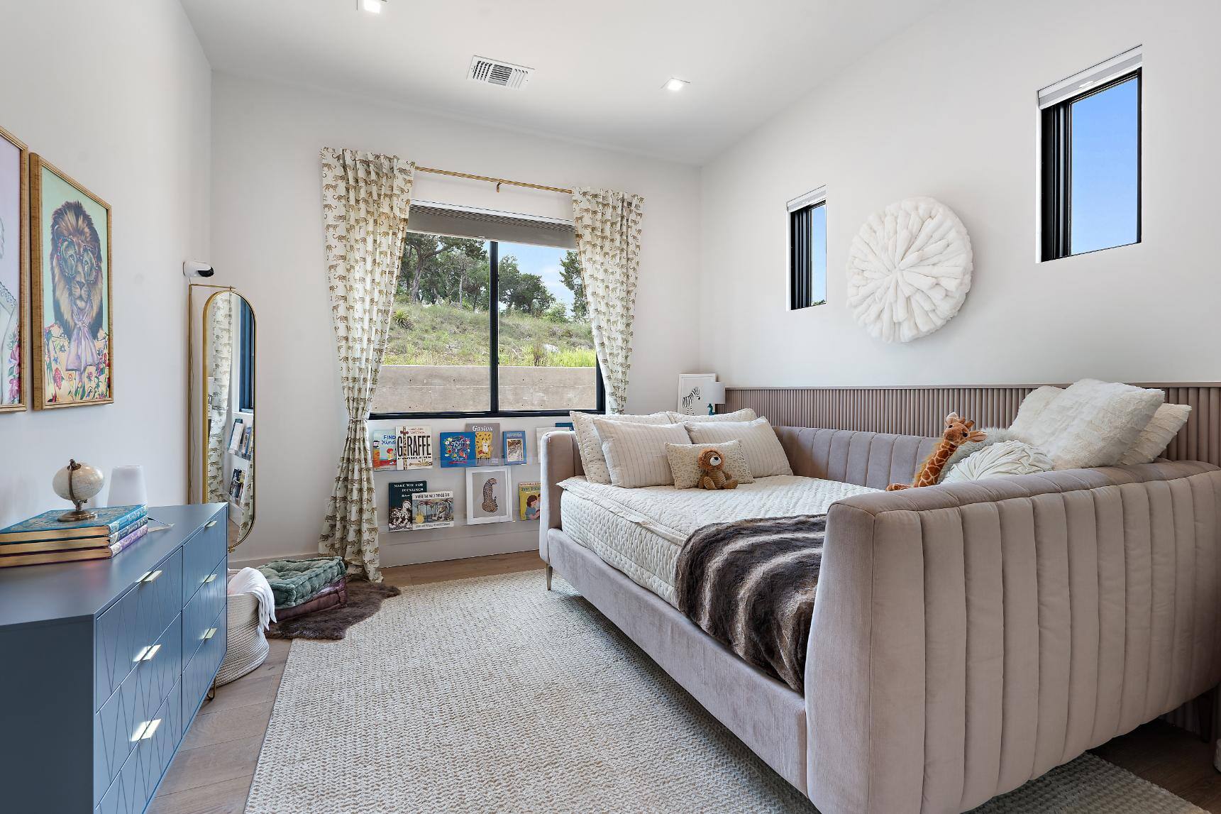 Custom homes kids room featuring a daybed and reading nook by J. Angelo Design Build in Southwest Austin, TX