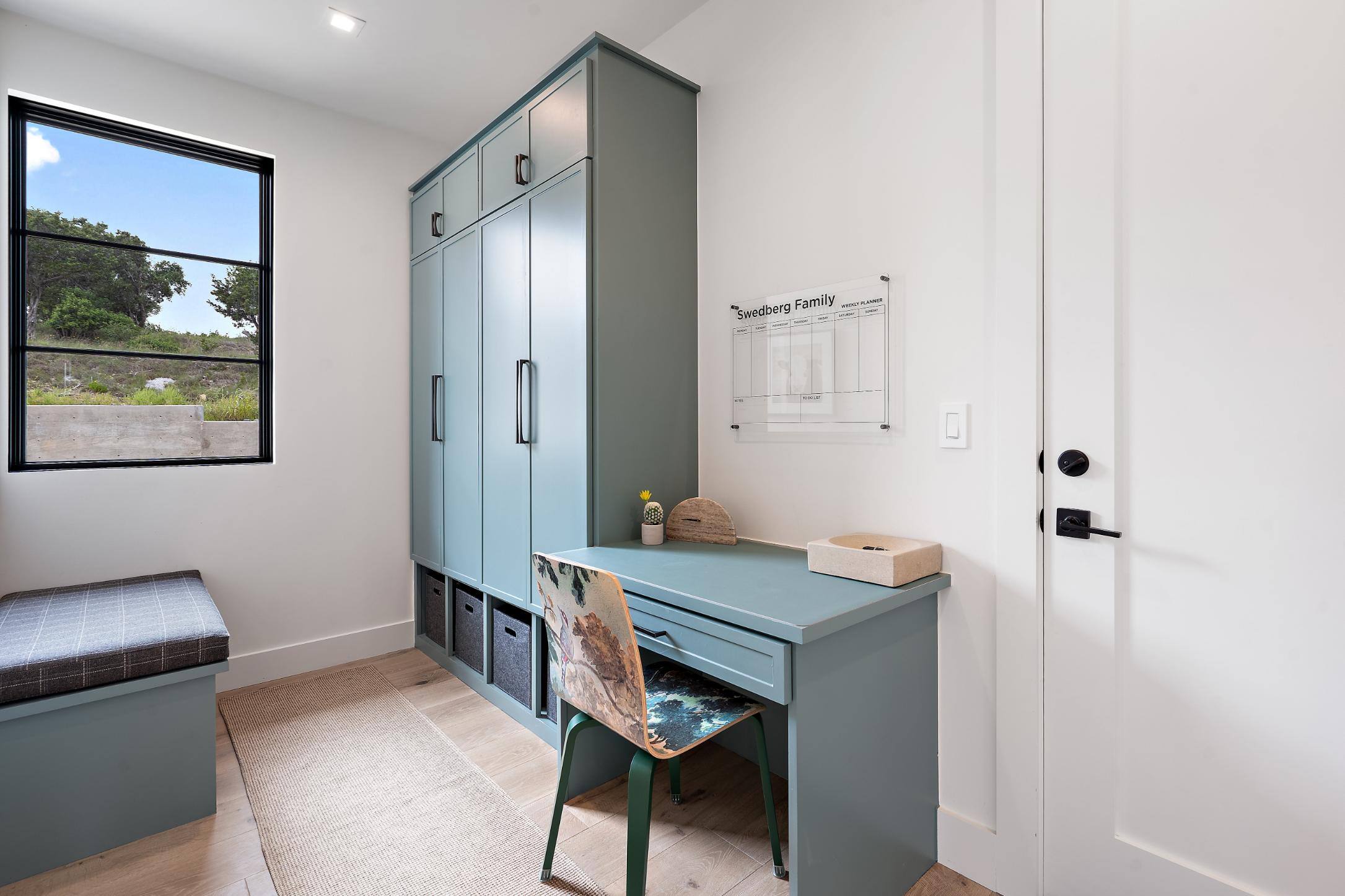 Functional study area with built-in storage in a custom home by J. Angelo Design Build in Southwest Austin, TX