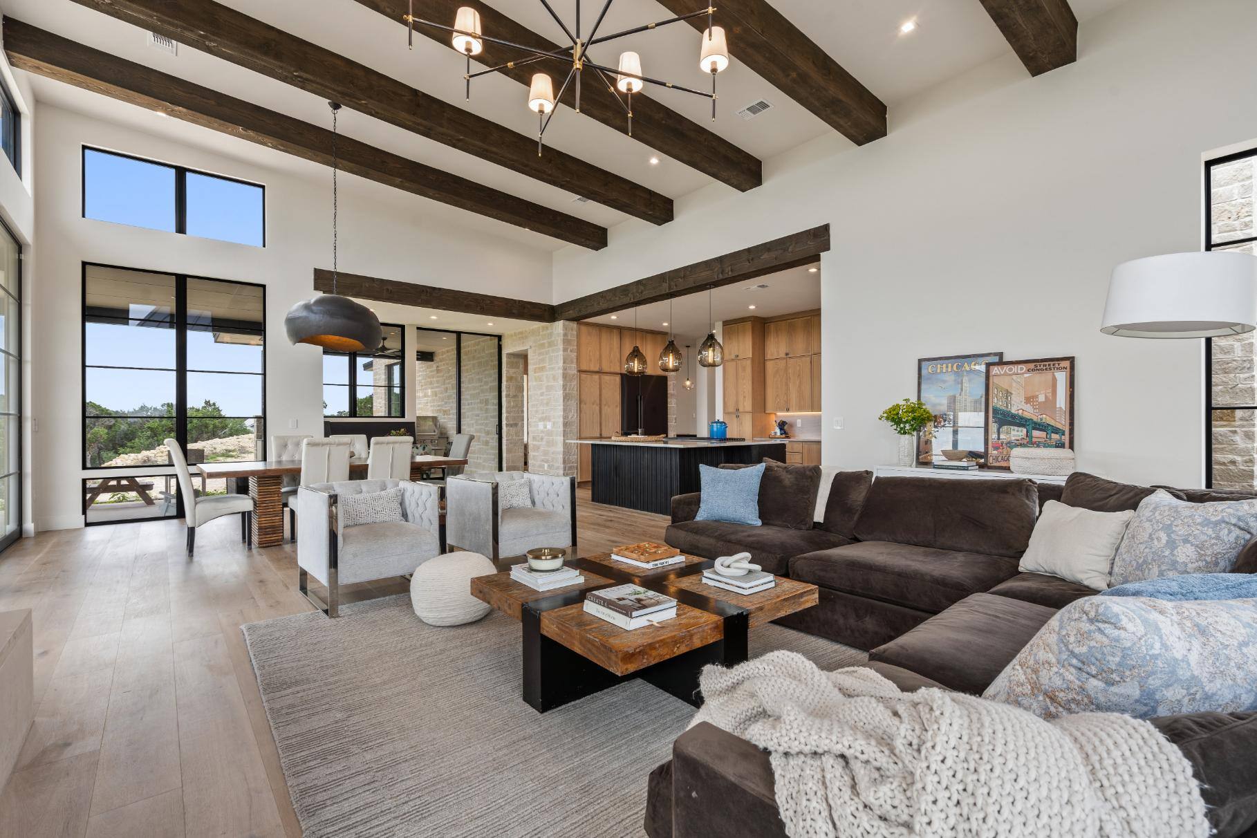 Living room open plan with dining area and kitchen in custom home by J. Angelo Design Build in Southwest Austin, TX