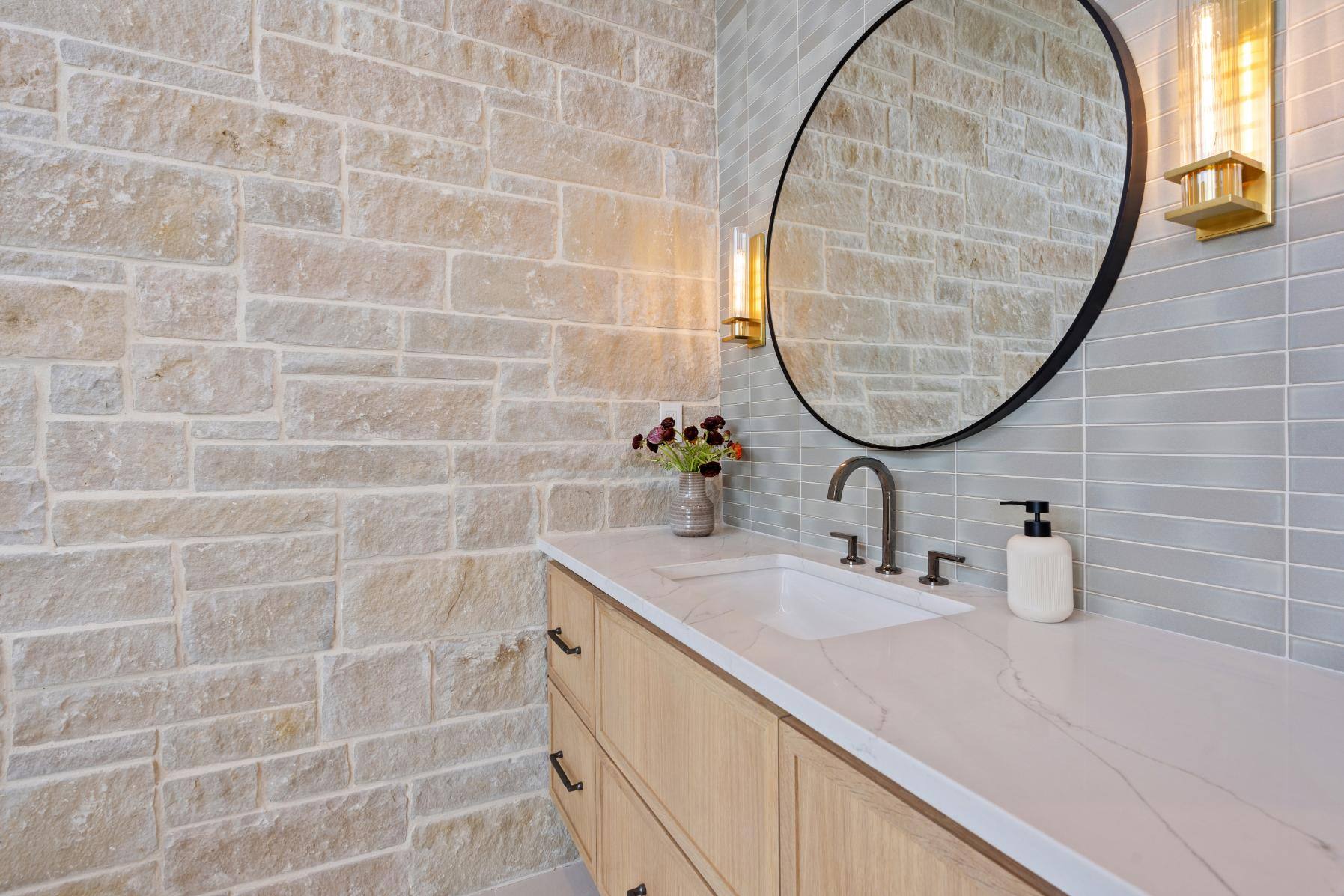 Master bathroom brick wall and backsplash of sink area custom home by J. Angelo Design Build in Southwest Austin, TX