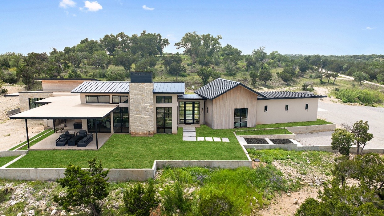 Custom modern home by J. Angelo Design Build in Southwest Austin, TX, featuring large windows and open patio space