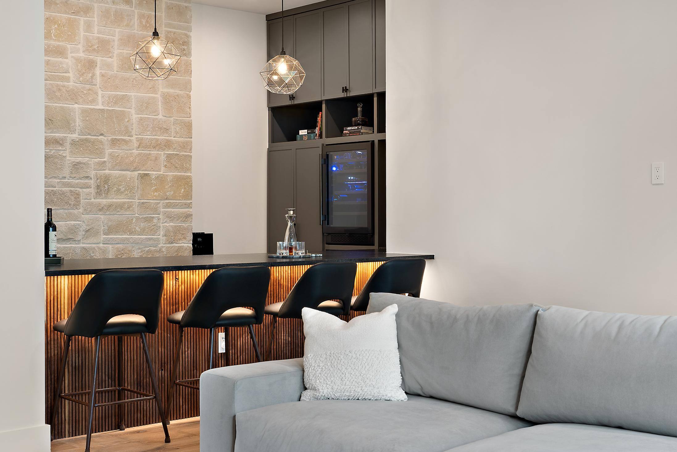 Partial view of bar area within open floor plan in custom home built in Austin, TX by J. Angelo Design Build