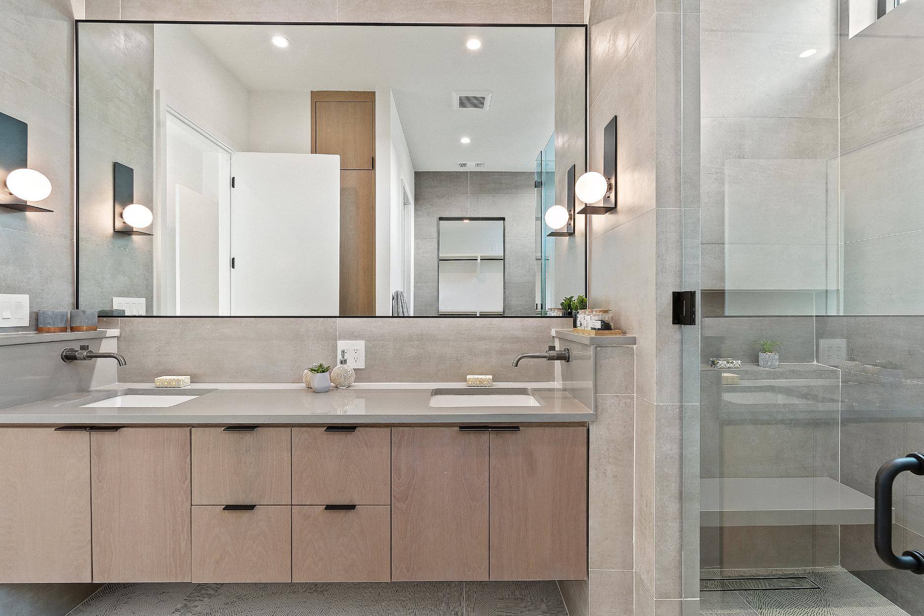 Custom primary bathroom vanity and shower in custom home by J. Angelo Design Build in Austin, TX