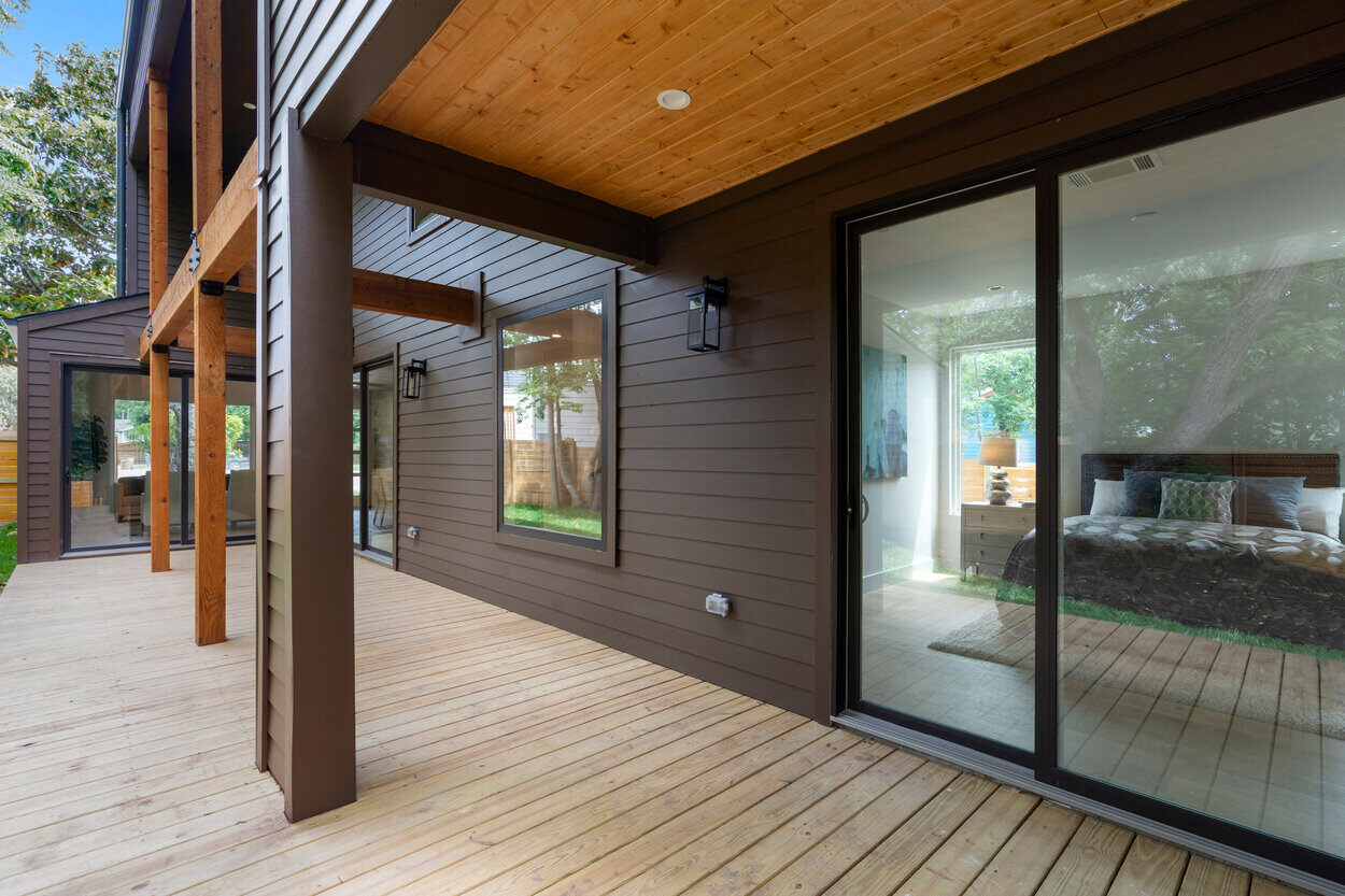 Exterior of ground-level with a view of the living room of custom home in Austin, TX by J. Angelo Design Build
